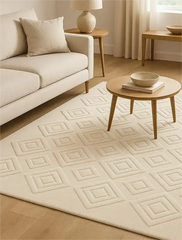 Luxury sculpted cream wool rug for contemporary home interiors.