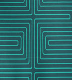 Close-up of luxury turquoise maze geometric pattern on handwoven Mannat rug