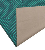 Turquoise maze pattern luxury rug with beige non-slip backing corner folded, handwoven from Mannat Rugs