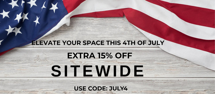 Promotional text for an extra 15% off site-wide with a code on a wooden background with American flag.