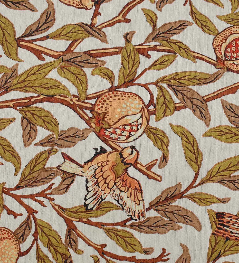 Low-profile beige rug with terracotta and green botanical designs.