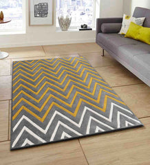 Hand-tufted geometric zig-zag pattern area rug.