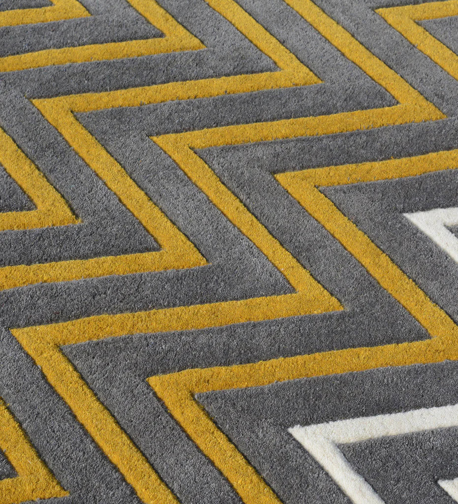 Contemporary chevron design rug with bold stripes.