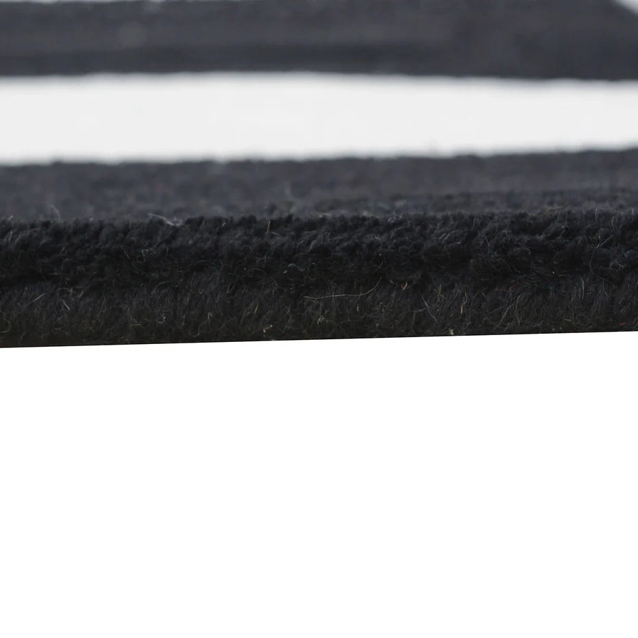 Close-up of black and gray fabric with a white background