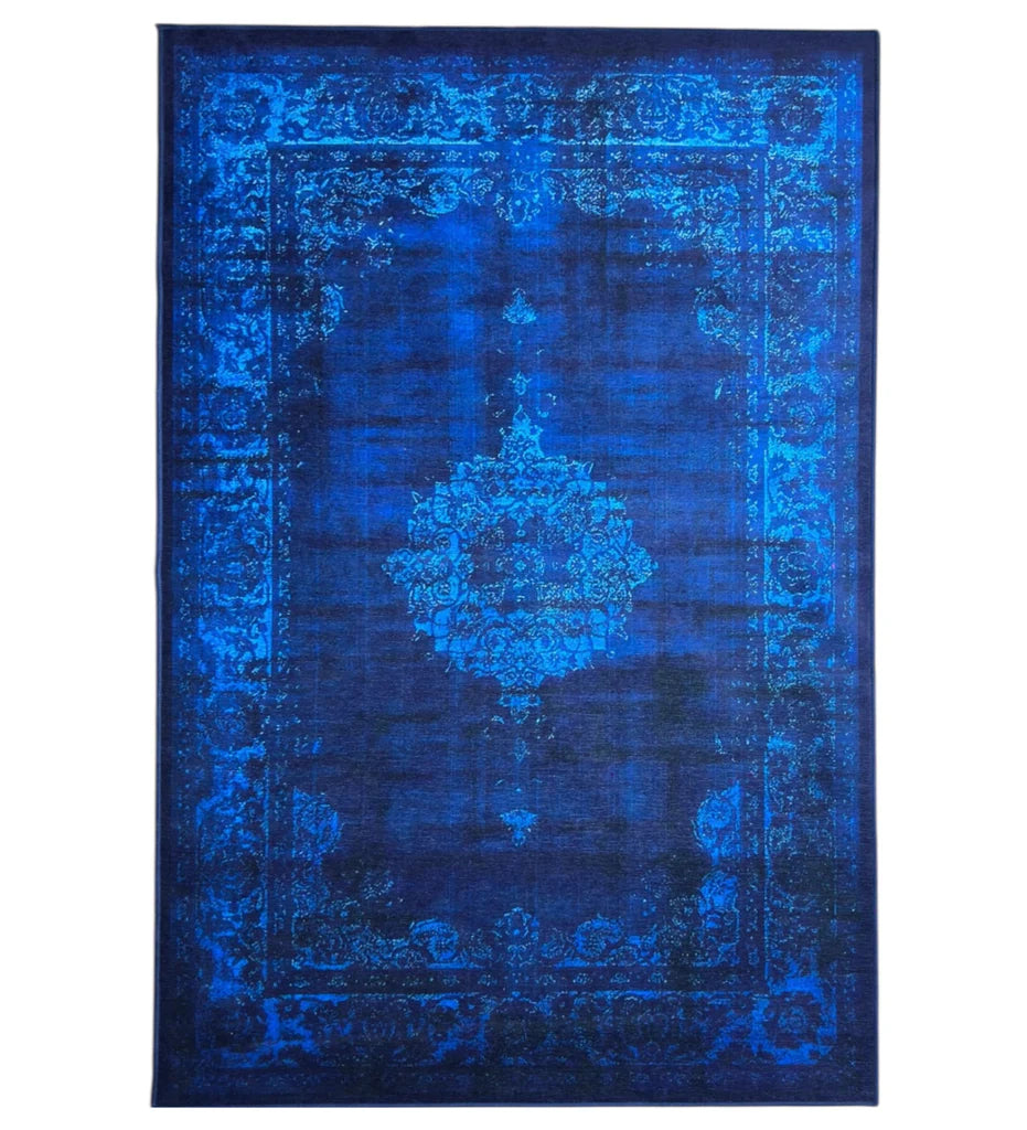 Blue patterned rug on a white background