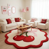 Living room with a cherry-themed rug, sofa, and coffee table.