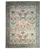 Decorative rug with floral and bird pattern on a white background