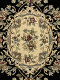 Close-up of an ornate rug with floral patterns on a black background