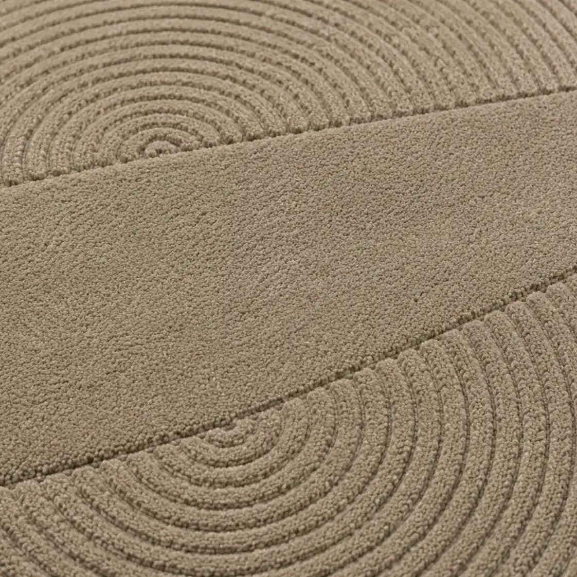 Close-up of a textured beige surface with circular patterns