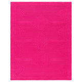 A bright pink rectangular rug with a raised geometric maze-like pattern, shown flat against a white background.
