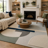 Living room with a beige sofa, armchair, coffee table, and geometric rug.

