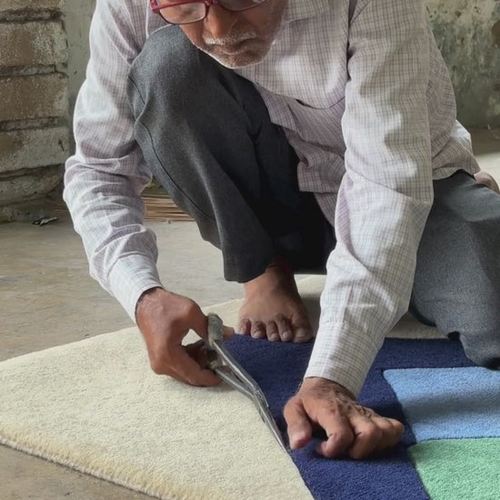Abstract geometric hand tufted rug with mountains design finishing process of hand tufting