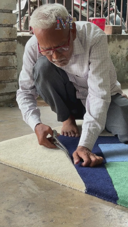 Abstract geometric hand tufted rug with mountains design finishing process of hand tufting
