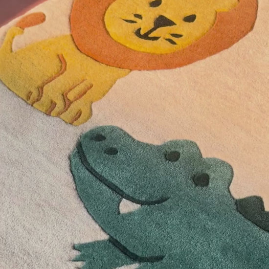 kids loving rug includes animals like elephant, giraffe, lion and crocodile.