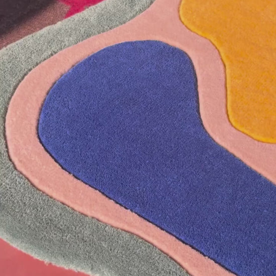 Colorful abstract wavy hand tufted rug