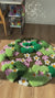 Nature-inspired hand-tufted area rug with plush moss-like surface and daisy flowers