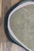 Minimalist wool rug with organic design for modern living room.